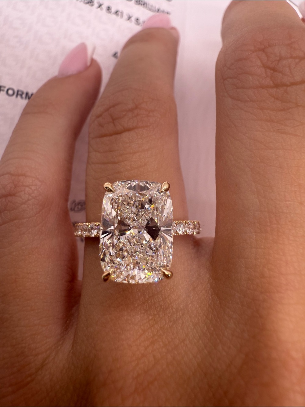 4.20 carat E VS1 cushion lab diamond on a pave band 14k yellow gold